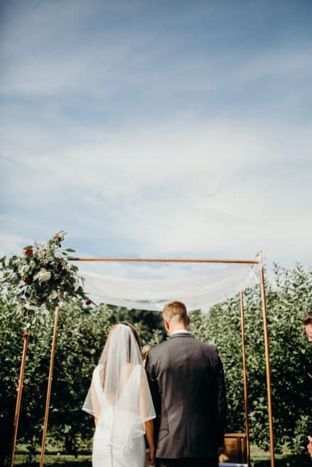 outdoor wedding venues copper arch wedding ceremony