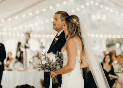 father escorts bride